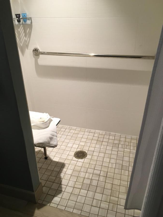 Standard Queen Room Roll Shower Communications Accessible