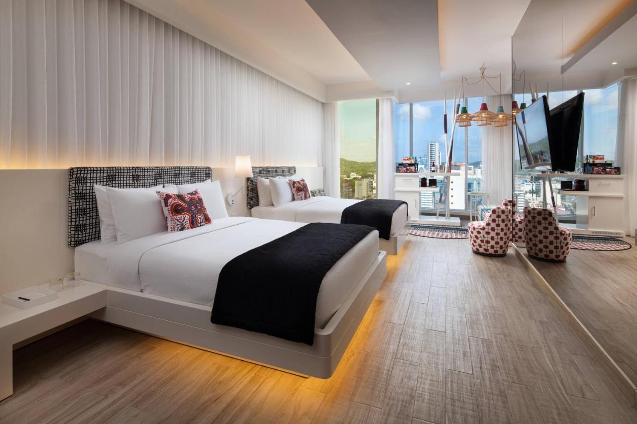 Standard Queen Room with Two Queen Beds and Partial City View