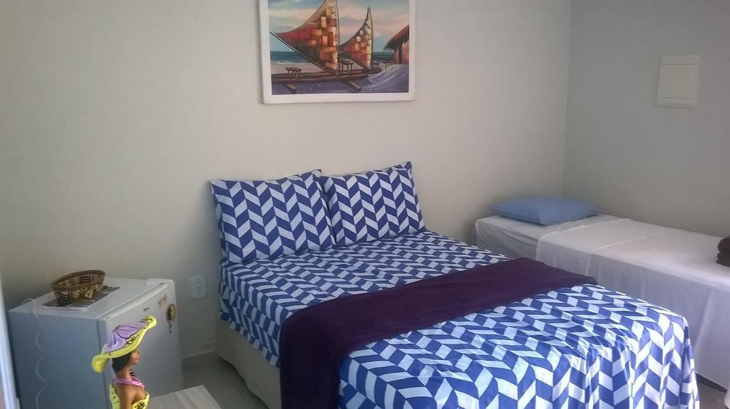 Quarto Triplo com Vista para a Piscina