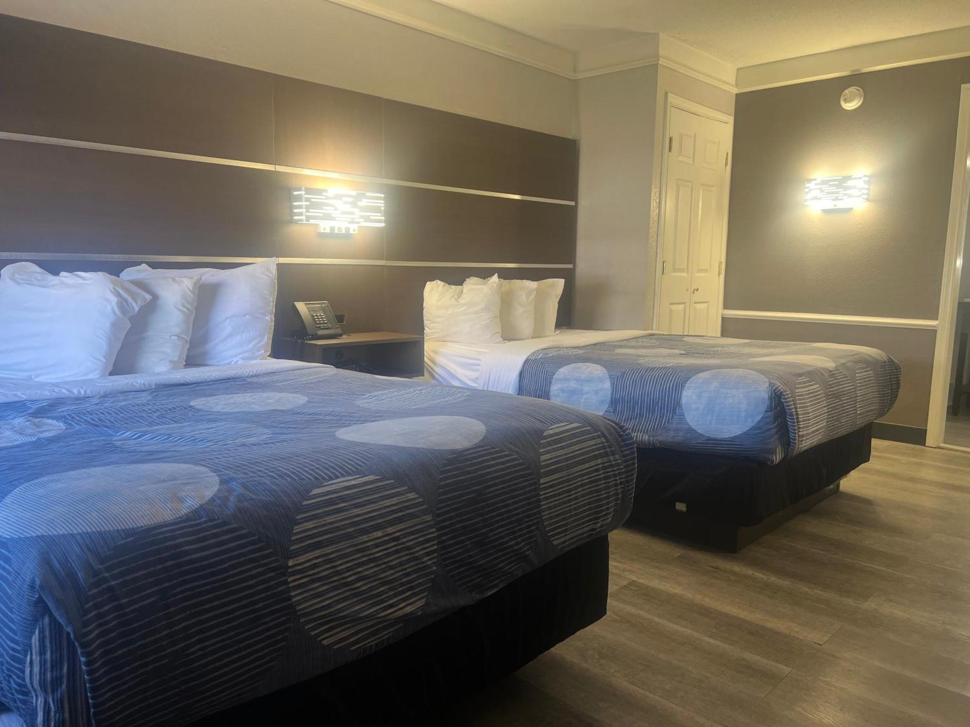 Double Room Two Double Beds Roll Shower Courtyard View Mobility Accessible or Non-Smoking
