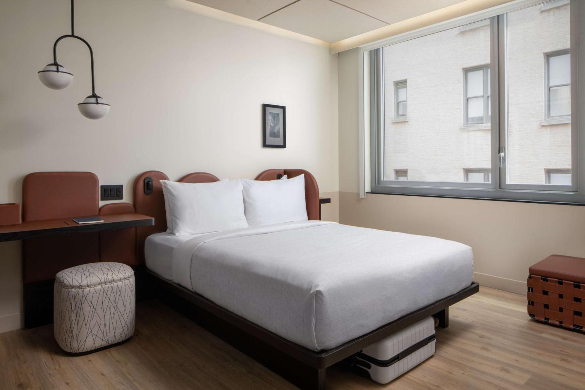 Compact Queen Room City View Communication Assistance