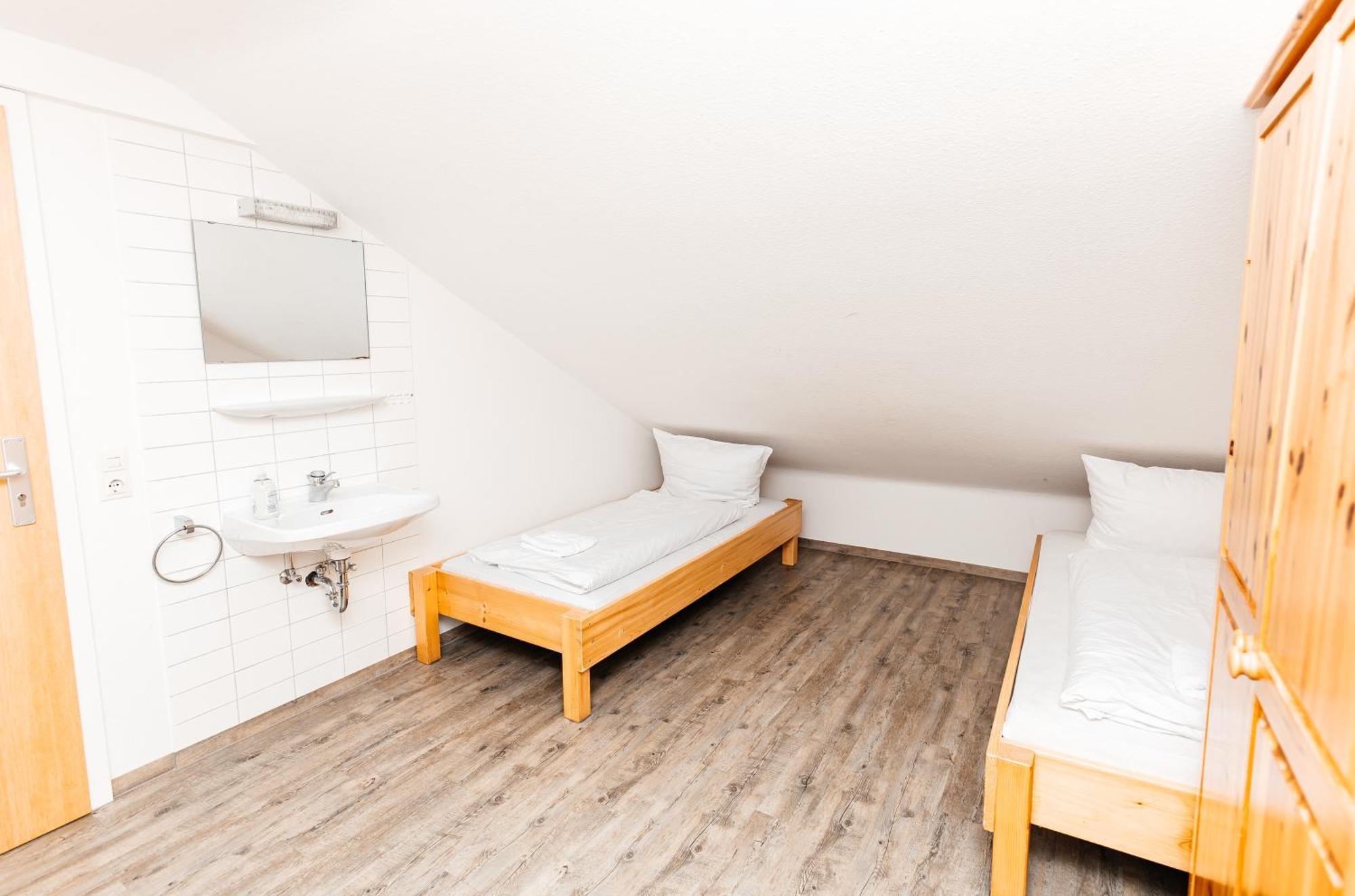Doppel- oder Zweibettzimmer