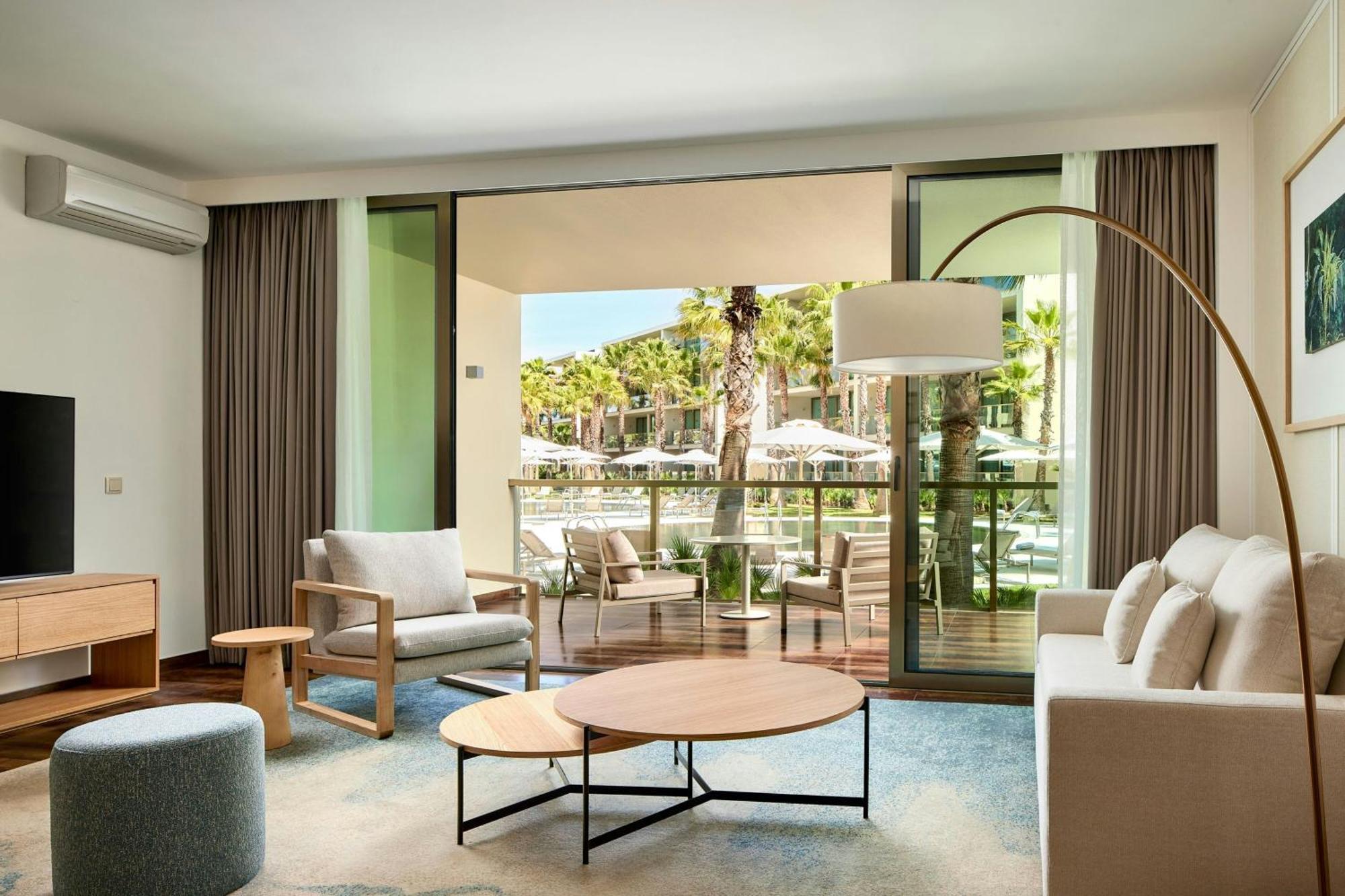 One-Bedroom King Suite Balcony Pool View