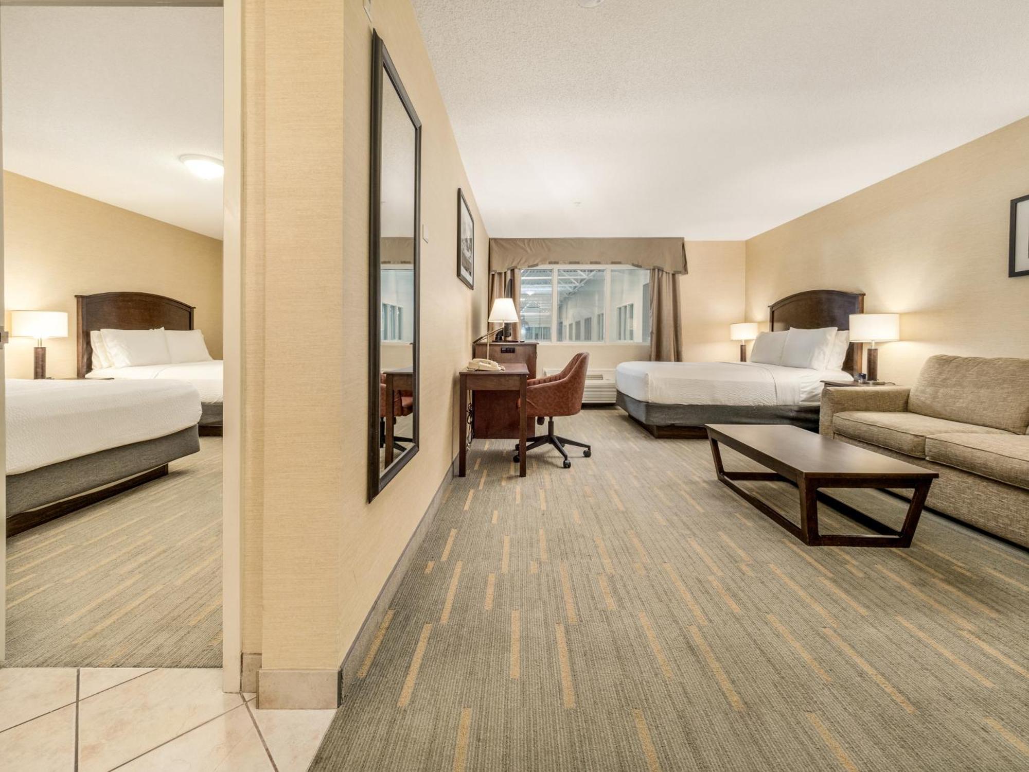 One-Bedroom Suite Three Queen One Sofa Bed Pool View