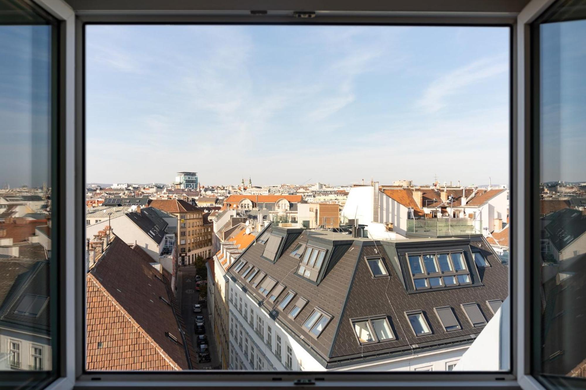 Standard King Room with One Single Bed and City View - Top Floor