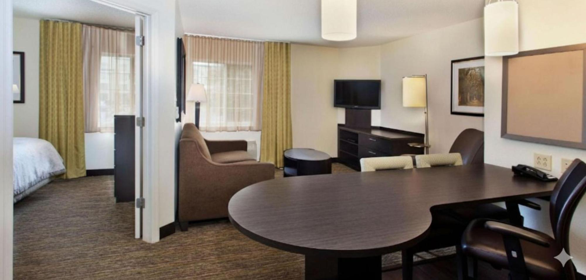 One-Bedroom Queen Suite Communications Mobility Accessible Roll Shower
