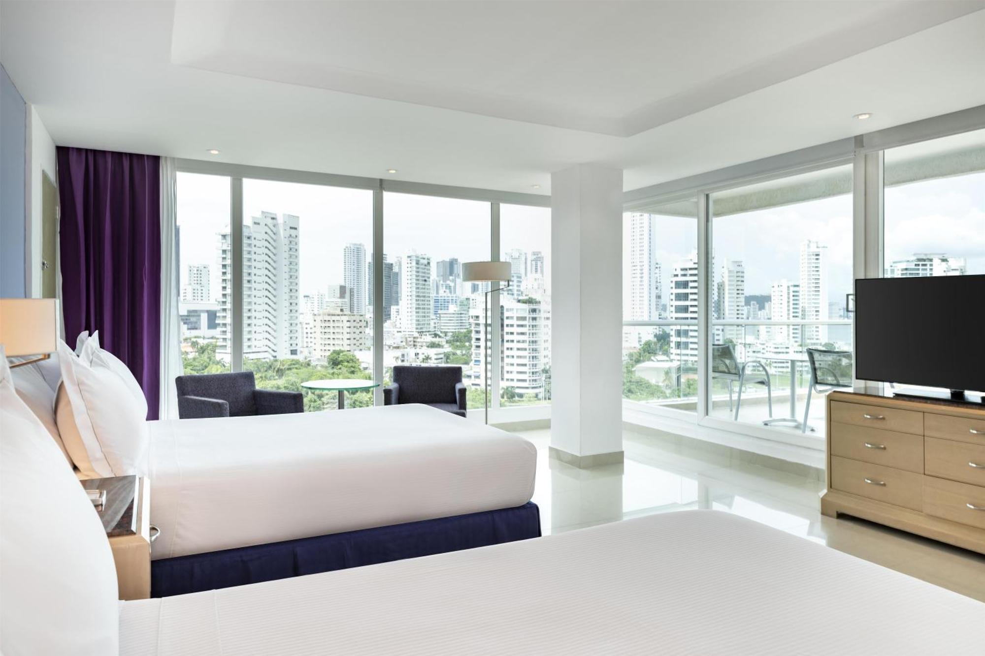 Two Queen Beds Corner Suite with City /Ocean View