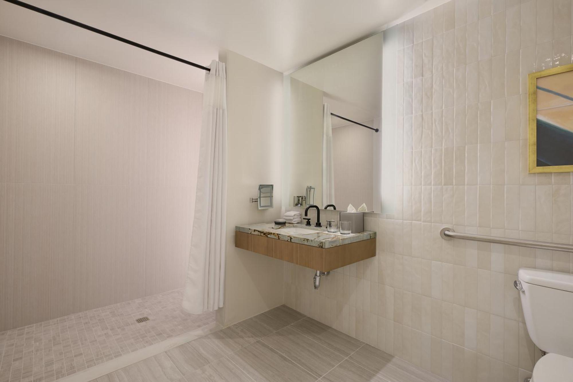 Deluxe King Room with Roll-In Shower - Mobility and Hearing Accessible