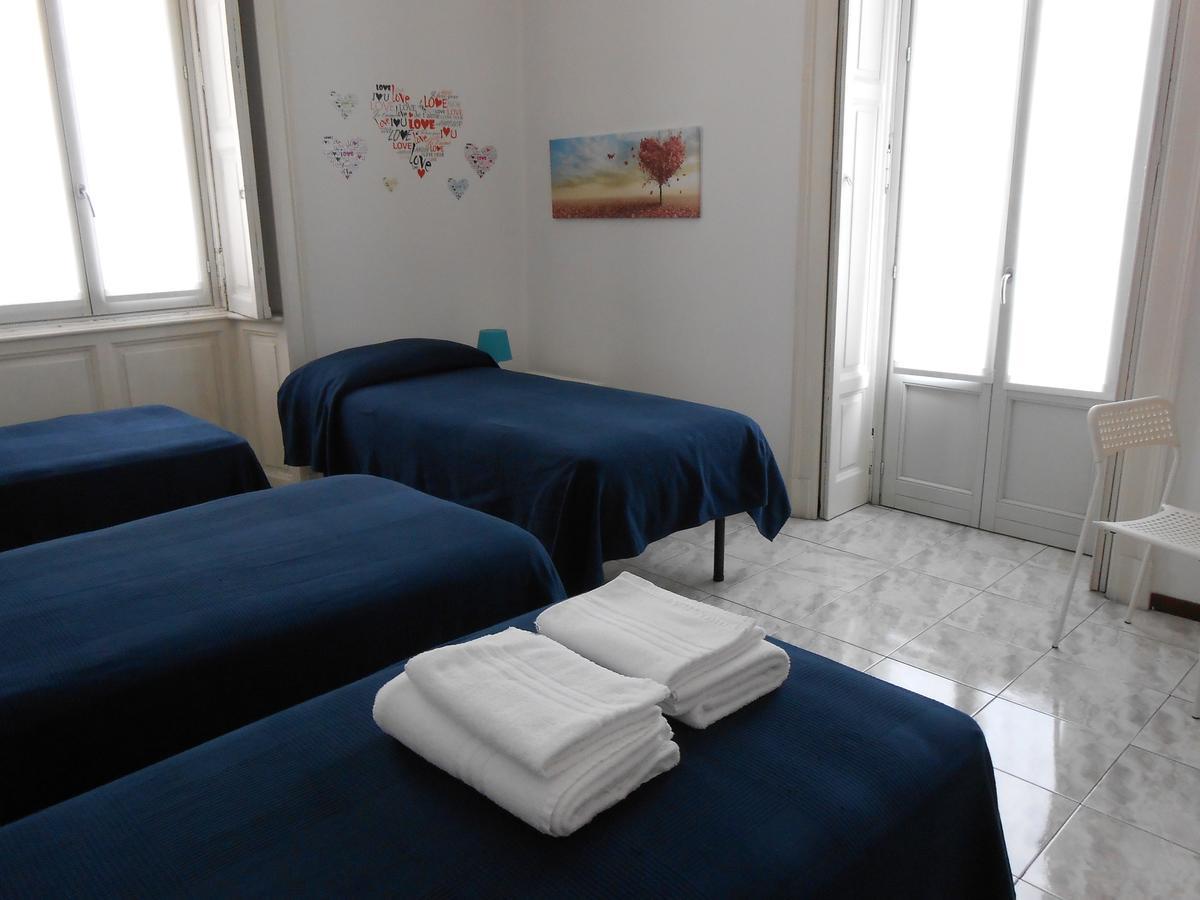 Camera Familiare con Bagno in Comune